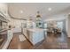 Spacious kitchen open to the living and dining areas, featuring a large island and stainless steel appliances at 5128 Oakhaven Ln, Fort Mill, SC 29708