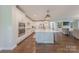 Open concept kitchen with a large island, stainless steel appliances, and a view into the living room at 5128 Oakhaven Ln, Fort Mill, SC 29708