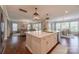 Well-lit kitchen with an island, stainless steel appliances, and a view into the living and dining areas at 5128 Oakhaven Ln, Fort Mill, SC 29708