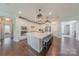 Bright kitchen with a spacious island, stainless steel appliances, and a seamless connection to other living areas at 5128 Oakhaven Ln, Fort Mill, SC 29708