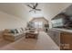 Expansive living room with plush seating, TV, and a gaming area at 5128 Oakhaven Ln, Fort Mill, SC 29708