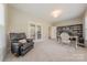 Bright home office with French doors, built-in bookcases, and comfortable seating at 5128 Oakhaven Ln, Fort Mill, SC 29708