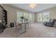Functional office space with large windows, neutral colors, and ample natural light at 5128 Oakhaven Ln, Fort Mill, SC 29708