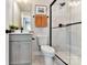 Modern bathroom with sleek vanity, frameless glass shower and decorative black fixtures at 518 Lockwood Creek Dr # 32, Charlotte, NC 28208