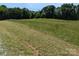 Picturesque land with tall grasses and trees for a private retreat at 5908 Tanson Trl, Marshville, NC 28103