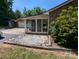 Sun room featuring large windows, a brick foundation, and a view of the expansive yard at 5908 Tanson Trl, Marshville, NC 28103