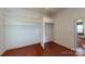 Spacious closet in bedroom with built-in shelving and curtain for privacy at 600 E 35Th St, Charlotte, NC 28205