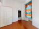 Bright, airy bedroom with hardwood floors and a colourful window dressing at 600 E 35Th St, Charlotte, NC 28205