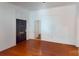 Cozy living room space with hardwood flooring and dark front door at 600 E 35Th St, Charlotte, NC 28205