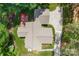Aerial view of a home with a deck, large lawn, mature trees and long driveway at 6599 Majestic Pine Dr, Vale, NC 28168