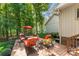 Secluded back deck featuring outdoor seating and a lush, green wooded backdrop at 6599 Majestic Pine Dr, Vale, NC 28168