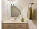 Well-lit bathroom vanity with light marble countertop, neutral walls, and accent decor at 6599 Majestic Pine Dr, Vale, NC 28168