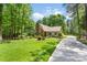 Beautiful single-Gathering home with a stone chimney and a long driveway at 6599 Majestic Pine Dr, Vale, NC 28168