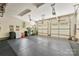 Spacious garage with multiple doors, overhead lighting, and ample space for vehicles and storage at 6599 Majestic Pine Dr, Vale, NC 28168
