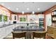 Modern kitchen with white cabinets, dark countertops, and an island with seating at 6599 Majestic Pine Dr, Vale, NC 28168