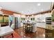 Well-lit kitchen featuring stainless steel appliances and hardwood floors at 6599 Majestic Pine Dr, Vale, NC 28168