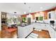 Open kitchen features a central island, stainless steel appliances, and hardwood floors at 6599 Majestic Pine Dr, Vale, NC 28168