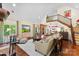 Bright, open living room with hardwood floors, vaulted ceiling, and staircase at 6599 Majestic Pine Dr, Vale, NC 28168