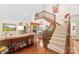 Bright, open living room with hardwood floors, staircase, and view of dining area at 6599 Majestic Pine Dr, Vale, NC 28168