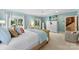 Sunny main bedroom with light blue walls, backyard views, and access to the ensuite bathroom at 6599 Majestic Pine Dr, Vale, NC 28168