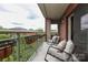 Relaxing balcony space with comfortable seating, offering an outdoor retreat at 721 Governor Morrison St # 520, Charlotte, NC 28211
