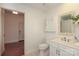 Bright bathroom with decorative framed mirror and modern fixtures, inviting a fresh, clean aesthetic at 721 Governor Morrison St # 520, Charlotte, NC 28211