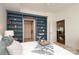 Inviting bedroom with custom blue built-in bookshelves leading to the bathroom and living area at 721 Governor Morrison St # 520, Charlotte, NC 28211