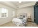 Bright bedroom with a plush bed, side tables, and soft carpet at 721 Governor Morrison St # 520, Charlotte, NC 28211