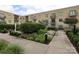 Beautiful courtyard with manicured garden and outdoor seating perfect for relaxing in luxury apartments at 721 Governor Morrison St # 520, Charlotte, NC 28211
