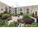 Manicured courtyard with hedges and planters for sophisticated outdoor living in upscale apartments at 721 Governor Morrison St # 520, Charlotte, NC 28211