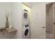 Convenient laundry area features a stacked washer and dryer, optimizing space and functionality at 721 Governor Morrison St # 520, Charlotte, NC 28211