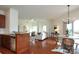 Spacious open-concept layout with a kitchen, living room, and dining area featuring hardwood floors at 721 Governor Morrison St # 520, Charlotte, NC 28211