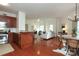 Bright, open-concept layout with a kitchen, living and dining area, hardwood floors and modern finishes at 721 Governor Morrison St # 520, Charlotte, NC 28211