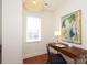 Bright office space with a wooden desk, stylish light fixture, and contemporary artwork at 721 Governor Morrison St # 520, Charlotte, NC 28211