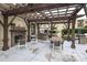 Community outdoor grill and lounge area with fireplace, perfect for entertaining or relaxing at 721 Governor Morrison St # 520, Charlotte, NC 28211