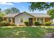 Charming single-story home with brick and siding exterior, manicured bushes, and a well-kept lawn at 728 Dedmon Dr, Charlotte, NC 28216