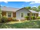Inviting single-story home with brick and siding exterior, neat shrubs, and a well-maintained front yard at 728 Dedmon Dr, Charlotte, NC 28216
