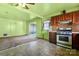 A classic kitchen with wood cabinets and view into the living area at 728 Dedmon Dr, Charlotte, NC 28216
