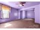 Large living room with a ceiling fan and window providing plenty of light at 728 Dedmon Dr, Charlotte, NC 28216