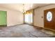 A living room with vintage lighting, large window with drapes, and visible wear at 728 Dedmon Dr, Charlotte, NC 28216