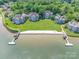 Aerial view of lakefront condos with a private beach and boat docks at 803 Lake Club Dr, Rock Hill, SC 29732