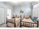 Charming bedroom featuring twin beds, soft lighting, and ensuite bathroom at 803 Lake Club Dr, Rock Hill, SC 29732