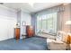 Relaxing bedroom featuring a bay window with a cushioned seat and comfortable furnishings at 803 Lake Club Dr, Rock Hill, SC 29732