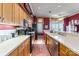 Functional kitchen featuring white countertops, wood cabinets, and modern appliances at 803 Lake Club Dr, Rock Hill, SC 29732