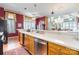Kitchen view overlooking the living room, featuring wood cabinets and stainless steel appliances at 803 Lake Club Dr, Rock Hill, SC 29732