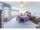Serene main bedroom featuring blue accents, ample natural light, and classic furnishings at 803 Lake Club Dr, Rock Hill, SC 29732