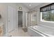 Bathroom featuring a large soaking tub, separate shower and plenty of space at 8211 Abbottsgate Ln, Charlotte, NC 28269