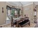 Cozy dining area with a wooden table, bench seating, and a large window at 8211 Abbottsgate Ln, Charlotte, NC 28269