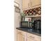 Kitchen area featuring modern appliances, a wine rack, and ample counter space at 8211 Abbottsgate Ln, Charlotte, NC 28269