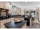 Bright kitchen featuring an island, stainless steel appliances, and bar seating at 8211 Abbottsgate Ln, Charlotte, NC 28269